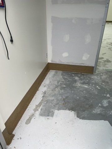 Epoxy cove base detail around a wall outlet