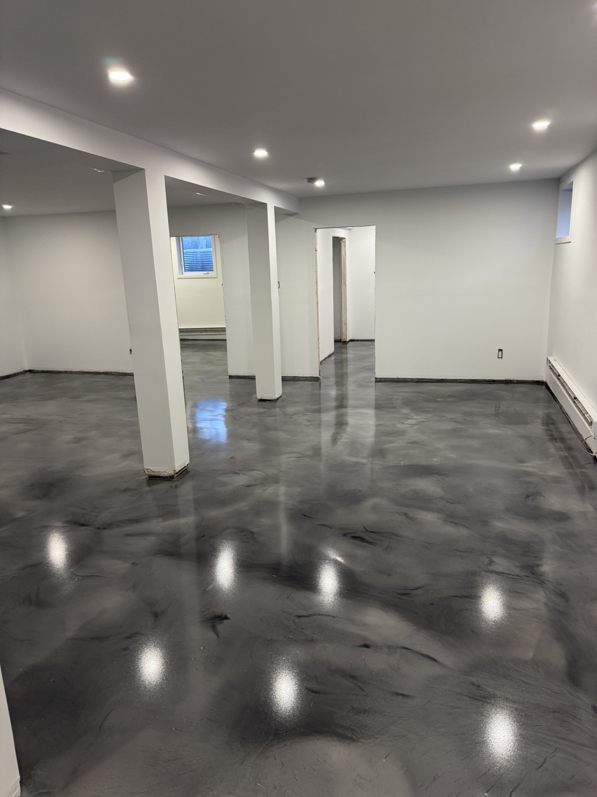 Charcoal and black metallic epoxy basement floor