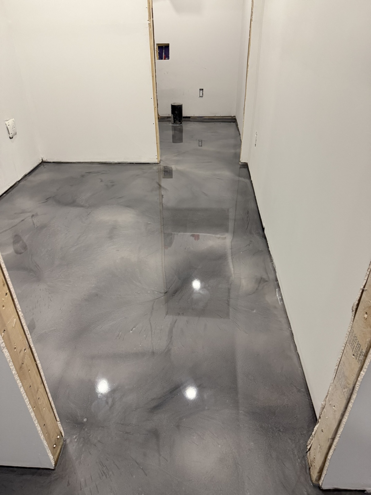 Gray metallic epoxy basement hallway