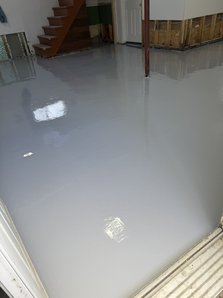 Finished gray one coat epoxy basement floor