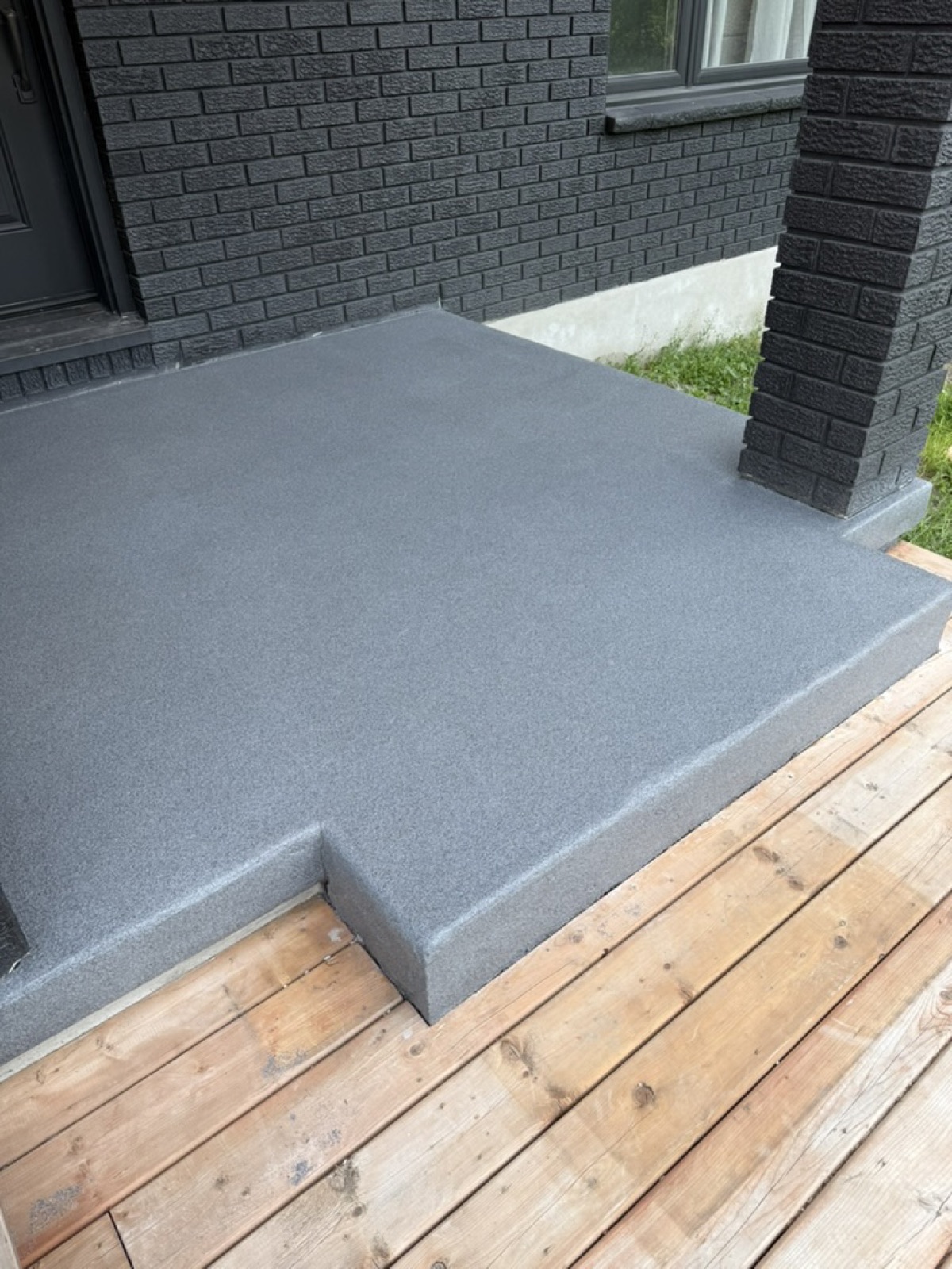 Finished black flake epoxy porch, stage three